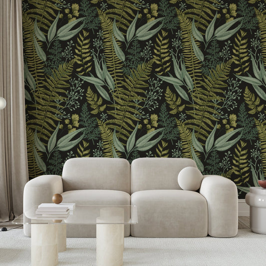 A living room with a cream sofa showing 'Kimberly' which is a vintage wallpaper featuring detailed green leaves and botanical foliage in an intricate repeating pattern on a soft neutral background.