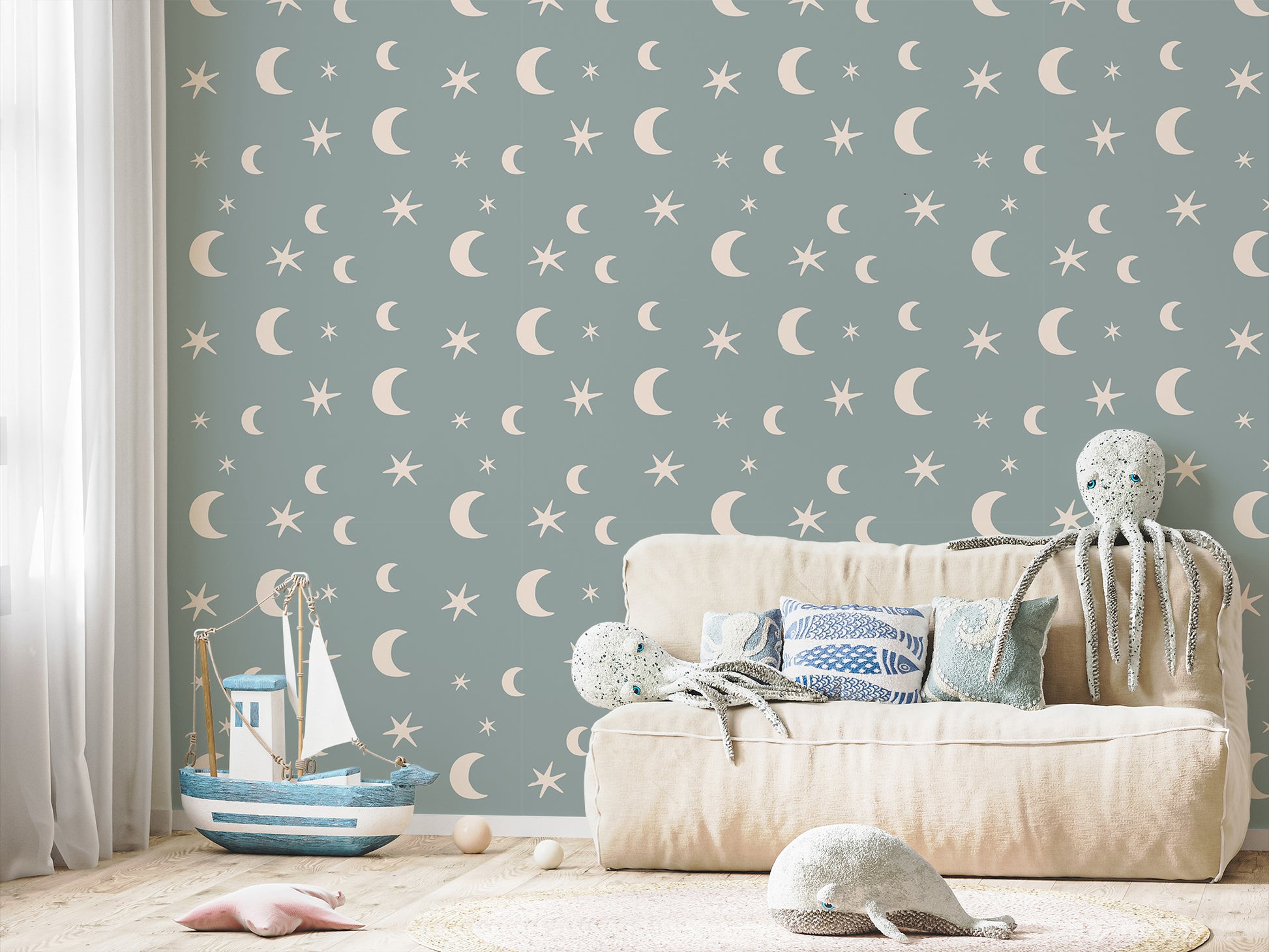 Danica Blue Boho Stars And Moon Nursery Wallpaper In Children's Playroom With Blue Boats, Octopus and Whales