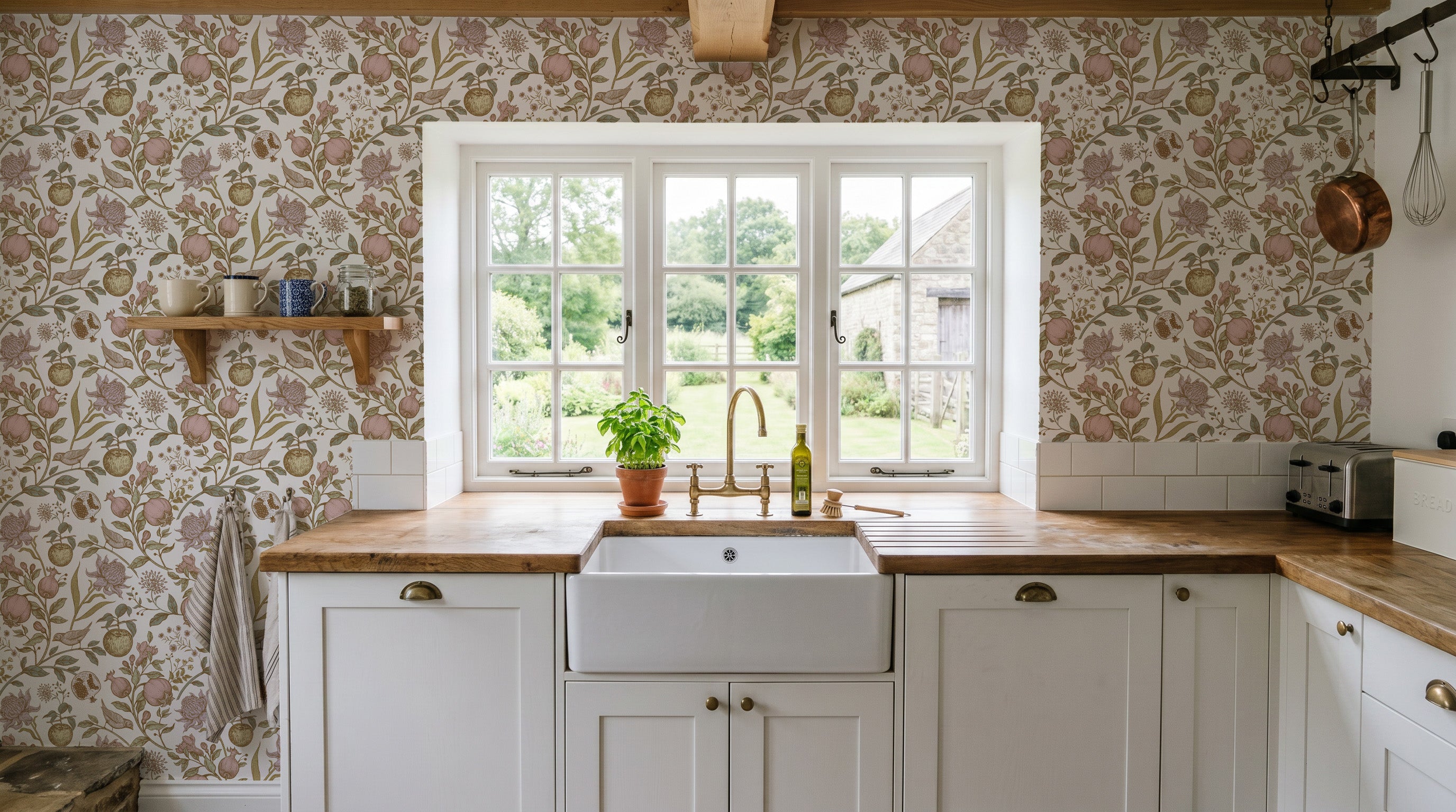 Kitchen with floral wallpaper, wooden countertops, and white cabinets.